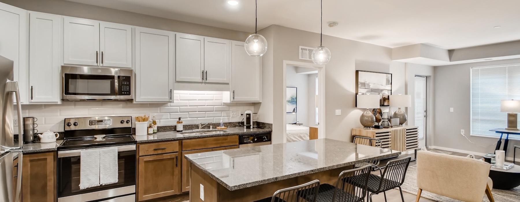 a kitchen with white cabinets