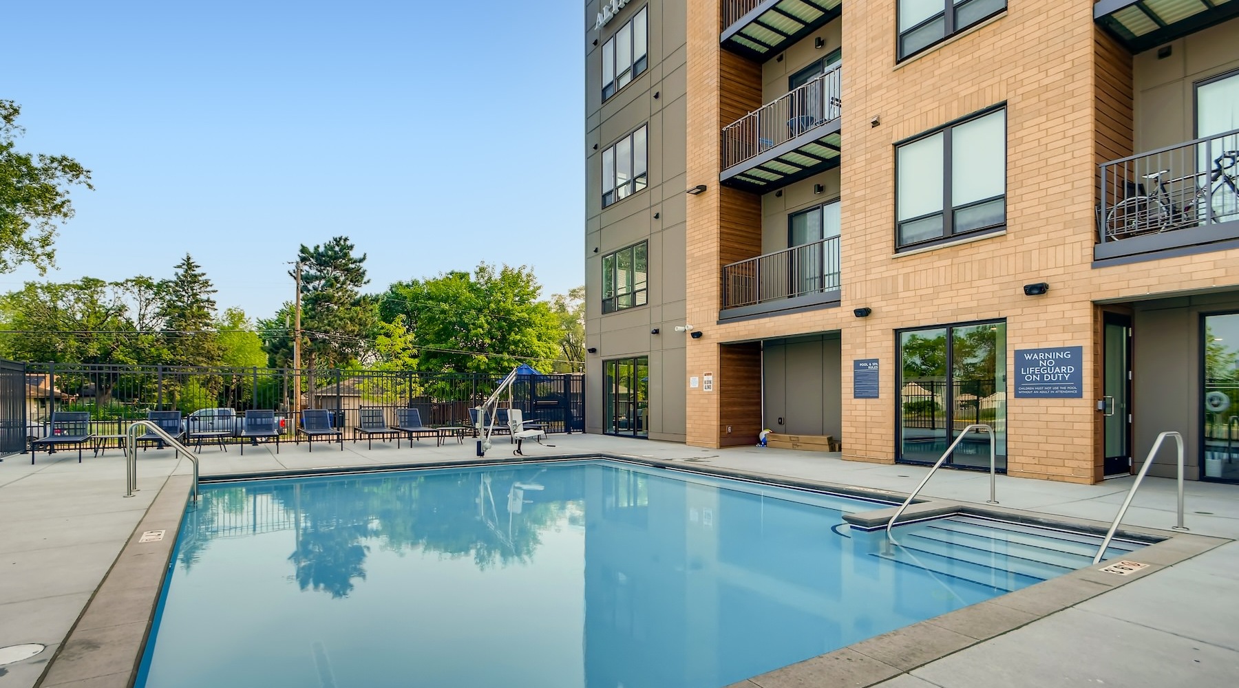 a swimming pool in front of a building