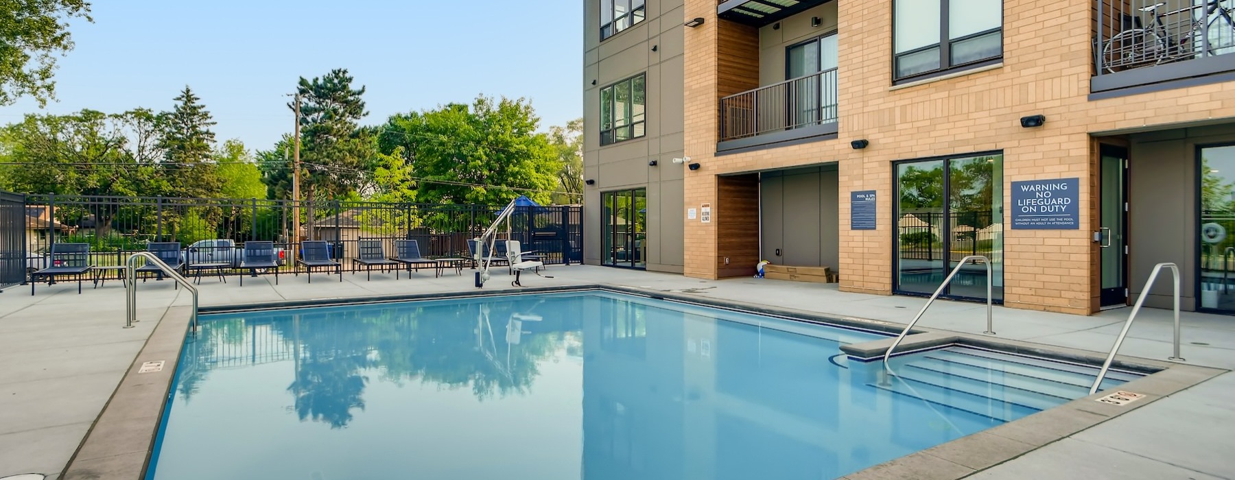 a swimming pool in front of a building