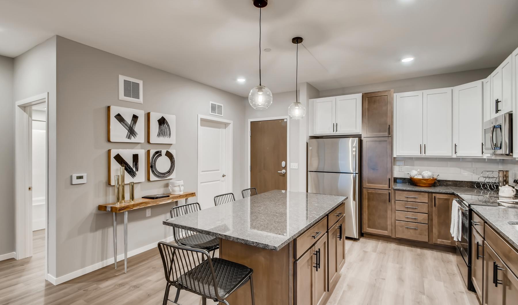 a kitchen with white cabinets