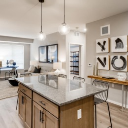 a kitchen with a marble island